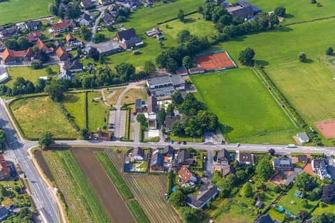 Aerial photo, Carl-Orff school, volunteer fire brigade, sports field SV Hilbeck, Hilbeck, Werl,