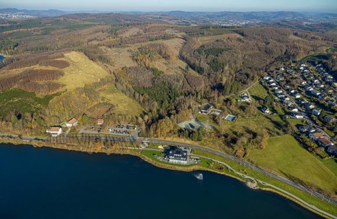 Aerial view, home harbour gastronomy on the lakeside promenade at Lake Sorpe and forest damage in