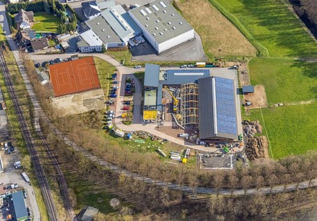 Aerial view, construction site and new building veterinary practice for horses and small animals in