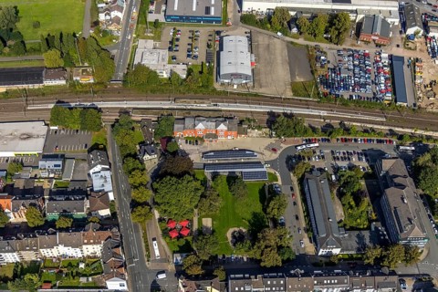 Aerial view, Schwelm railway station with red station building and bus station with solar roof and