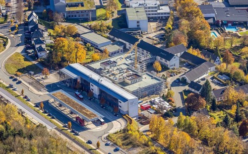 Aerial view, bus station and construction work at the vocational college Olsberg of the HSK in