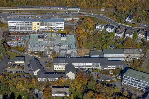 Aerial view, bus station and construction work at the vocational college Olsberg of the HSK in