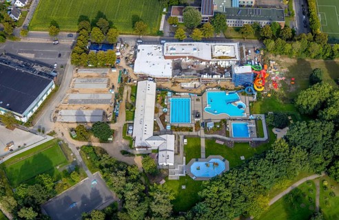 Aerial view, construction site and new construction of an indoor swimming pool at the Rheine