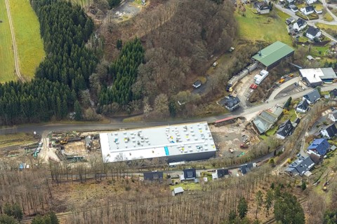 Aerial view, new construction of a factory building, sawmill Schrage, Neuenkleusheim, Olpe,