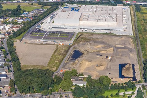 Aerial view, Edeka central warehouse Oberhausen with fallow land in the industrial park Waldteich