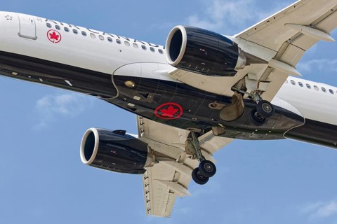 Passenger plane with deployed landing gear, Montreal, Province of Quebec, Canada