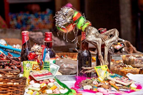 Traditional market stalls with colourful handicrafts and decorative objects, in a lively and