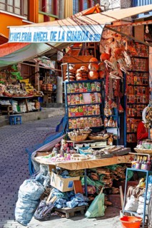 A stall at an Andean market with spices and colourful packaging, traditionally decorated, The