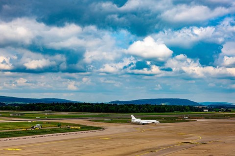 Private Jet Airplane Taxiing on Runway in a Sunny Summer Day From the Airport in Kloten, Zurich,
