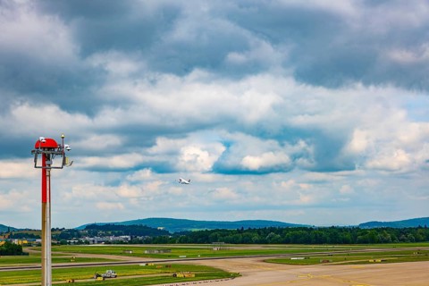 Swiss Airlines Passenger Airplane Take Off From the Runway and Flying Against Blue Sky and Clouds