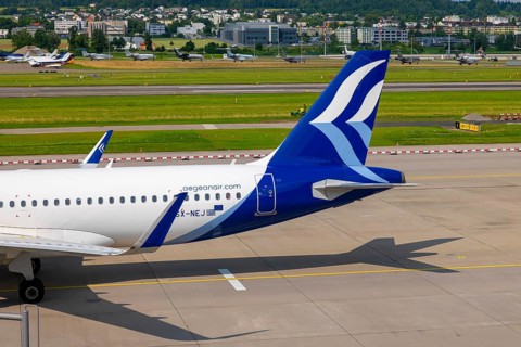 Aegean Airlines Passenger Airplane Taxiing on Runway in a Sunny Summer Day From the Airport in