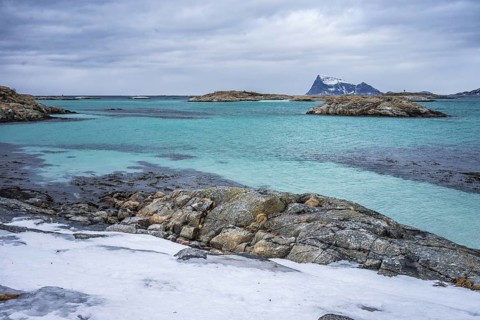 Norway tromsö snow mountains sea turquoise beach