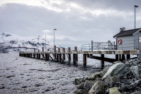 Norway tromsö snow mountains sea house jetty