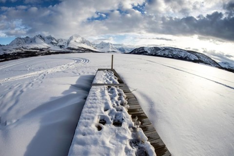 Norway tromsö snow mountains lake jetty frozen
