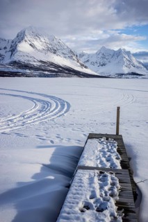 Norway tromsö snow mountains lake jetty frozen