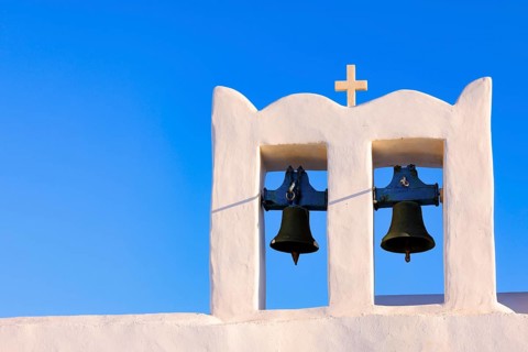 Sunrise serenity over Sifnos Iconic bells tower, Sifnos, Cyclades Islands, Greece