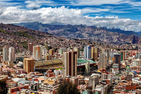 City view with skyscrapers and mountain landscape in the background, The houses and skyscrapers of