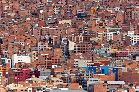 Dense collection of brick houses in an urban environment, The houses and skyscrapers of the city