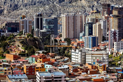 Urban landscape of La Paz with modern skyscrapers and bridge between hills, The houses and