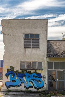 Graffiti with the word Bars on a dilapidated, urban building, at the harbour Linz Upper Austria