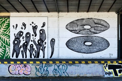 Abstract shapes and graphic patterns in black and white on a wall, at the harbour in Linz, Upper
