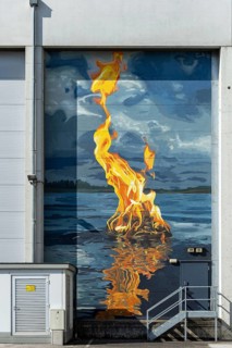 Fire flame on water surface as realistic wall painting, at the harbour Linz Upper Austria Austria