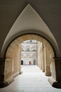 Arched passageway to an inner courtyard in a historic stone building, Arkardenhof Landhaus Linz