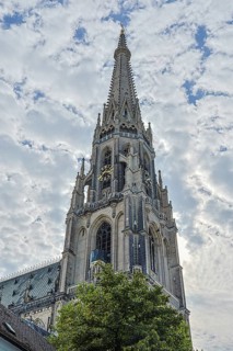 Gothic church tower rises high into the sky with detailed architecture, Linz Upper Austria Austria