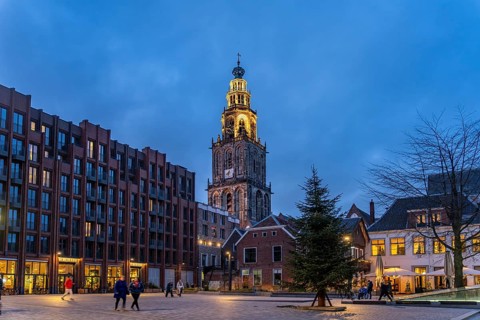 New Market and the Martinitoren church tower or Martinikerk church tower at dusk, Groningen,