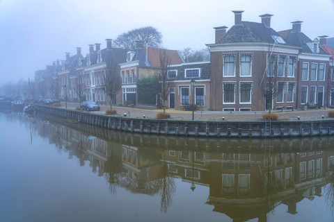 Typical canal in the winter fog, Harlingen, Friesland, Netherlands