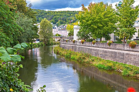Promenade and arcade footbridge on the Franconian Saale in Bad Kissingen, Bavaria, Germany
