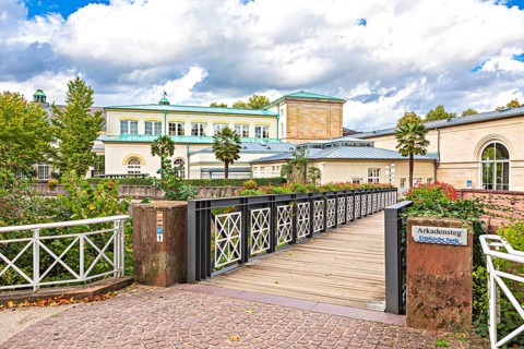 Promenade and arcade footbridge on the Franconian Saale in Bad Kissingen, Bavaria, Germany