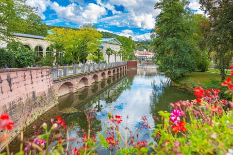 Promenade and arcade footbridge on the Franconian Saale in Bad Kissingen, Bavaria, Germany
