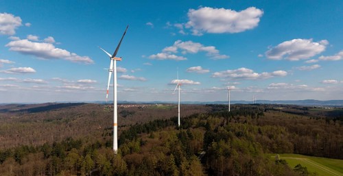 Wind turbines in a wooded area under a blue sky, maintenance work, repair, near Schorndorf im