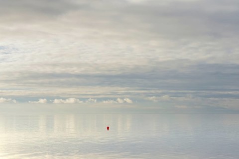 North Sea coast, special light atmosphere over the Wadden Sea with rising water and calm wind, red