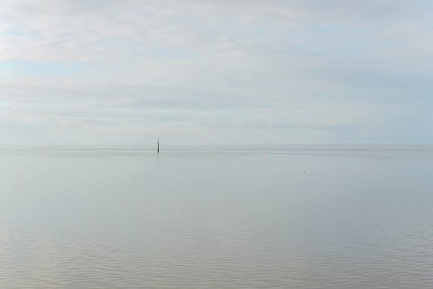 North Sea coast, special light atmosphere over the Wadden Sea with rising water and calm wind,