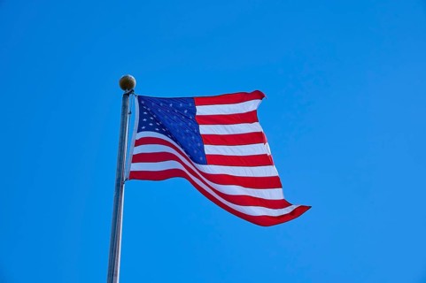 American flag flies majestically in front of a slightly cloudy sky, Flamingo, Everglades National