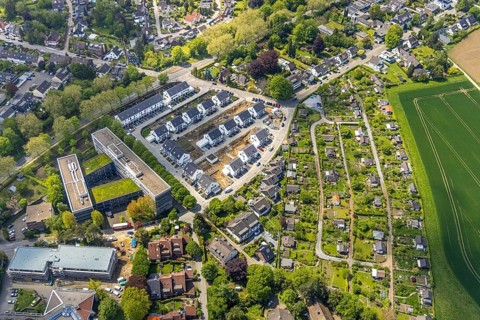 Aerial view, airport housing estate, building site and new building housing estate