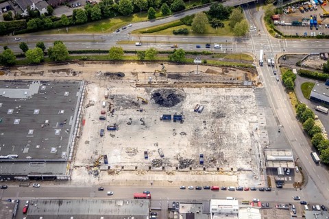 Aerial view, construction site harbour centre after real market fire, industrial area at Weseler