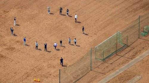 Aerial view, teenagers on sports field of Broich secondary school, Broich - Ost, Mülheim an der