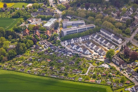 Aerial view, airport housing estate, building site and new building housing estate