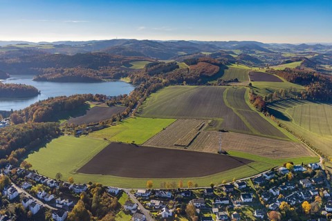 Aerial view, meadows and fields in autumnal hilly landscape at the Hennesee in the district