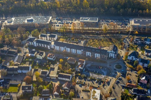 Aerial view, residential area and shopping centre Untere Promenade at the river Hönne in Menden,