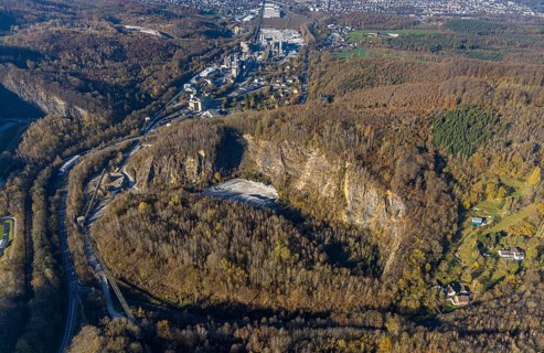 Aerial view, quarry at the Hönnetalstraße with commercial area and Rheinkalk GmbH in the district