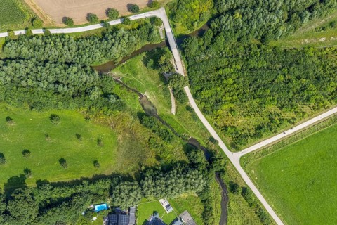 Aerial view, foot and cycle path Seseke-Weg with bridge over the river Seseke in the district