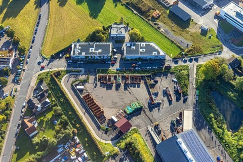 Aerial view, steel company building with solar roof opposite the recycling centre in the district