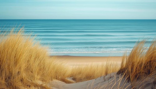 Stunning Tranquil Blue Sea With Waves And Sandy Beach Adorned With Reeds And Dry Grass On Dunes,