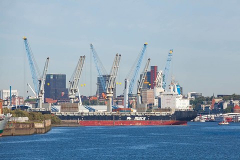 Hansa harbour with ship and skyscrapers of St. Pauli, Veddel, Hamburg, Germany