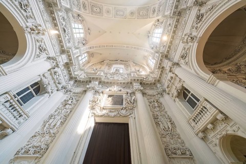 View of the richly decorated ceiling of a baroque church with architectural details, Munich,