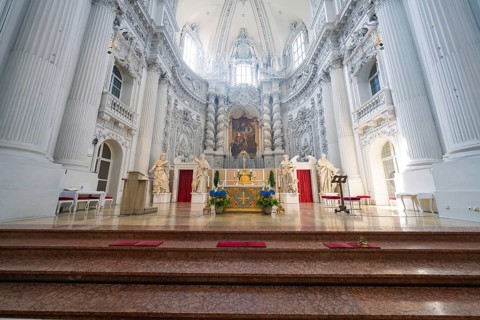 Magnificent baroque church interior with an ornate altar and lavish details, Munich, Germany